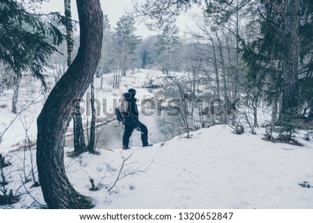 Similar – Image, Stock Photo Girl waiting at the side of the snowy mountain road looking down