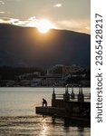 Fisherman at sunset overlooking institut Dr. Simo Milosevic