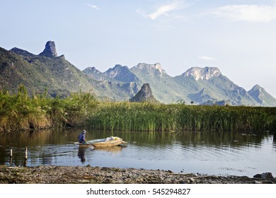 Fisherman  In Thailand, He Used Drift Net On The Boat For Fishin