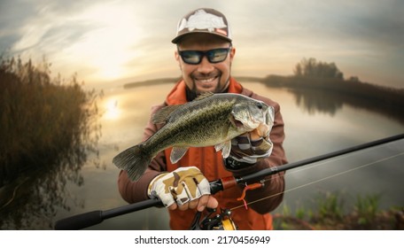 Fisherman and trophy Bass fish. Fishing background. 	
 - Powered by Shutterstock