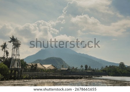A fisherman village with Mount Ringgit as background
