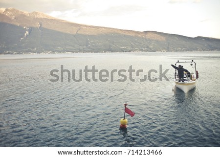 Similar – Image, Stock Photo Anglers on Lake Garda in Italy