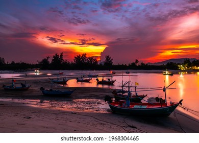 A fisherman's boat stops at the beach at sunset in Cha-am District, Phetchaburi Province, Thailand - Shutterstock ID 1968304465