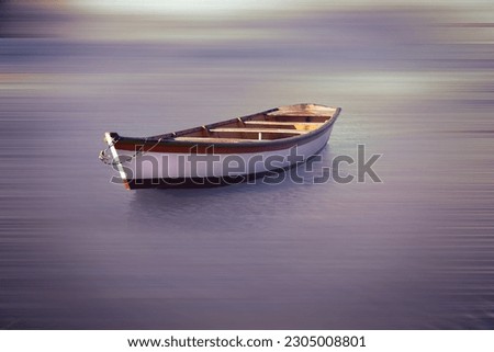 Fishermen boat floating in the cloudy river. Fine art