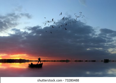 Fishermen in a boat at sunset - Powered by Shutterstock