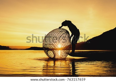 Fishermen fishing in the early morning golden light,fisherman fishing in Mekong River
,Thailand,Vietnam,myanmar,Laos