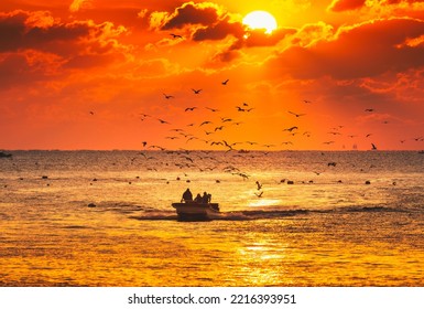 Fishermen Fishing On The Small Fishing Boat In The Ocean When Sunrising In Korea