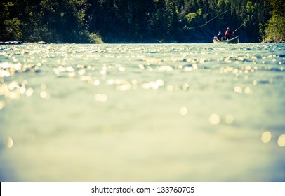 Fishermen fly fishing the salmon on a jolly-boat