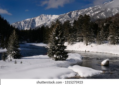 Fishermen On Madison River In Winter With Snowy Rocky Mountain Madison Range Montana