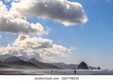 Fishermen On The Shore In Cannon Beach, Oregon.