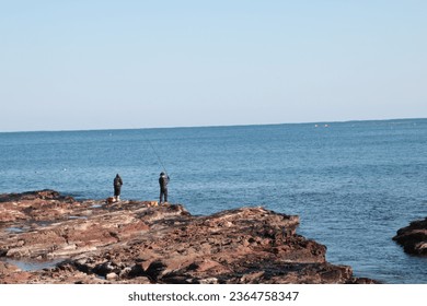 Fishermen and Waves by the Sea - Powered by Shutterstock