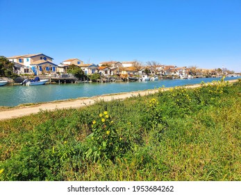Fishermen's houses from towpath, French coast, canal, Montpellier area