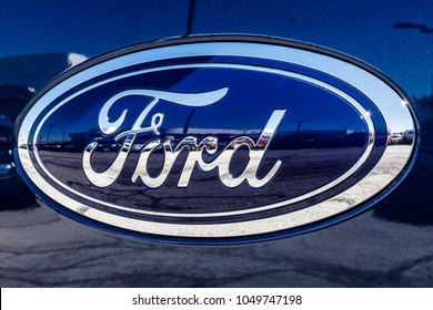 Fishers - Circa March 2018: Ford Oval Tailgate Logo On An F150 Pickup Truck. Ford Sells Products Under The Lincoln And Motorcraft Brands IV