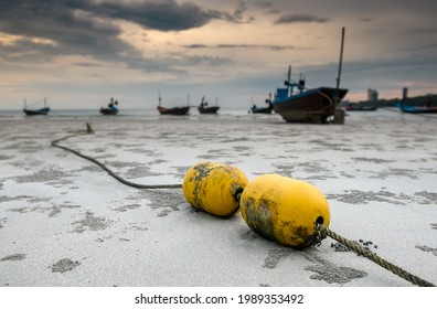 Fishery Boat Mooring Bouy On The Beach With Outdoor Low Sun Lighting.