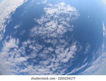fisheye photo of blue sky and white clouds without planes ideal as a background