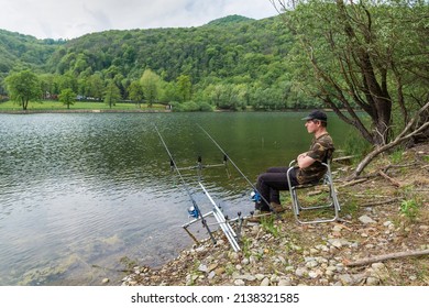 Fishing adventures, carp fishing. Man rests waiting to catch a fish with the carpfishing technique