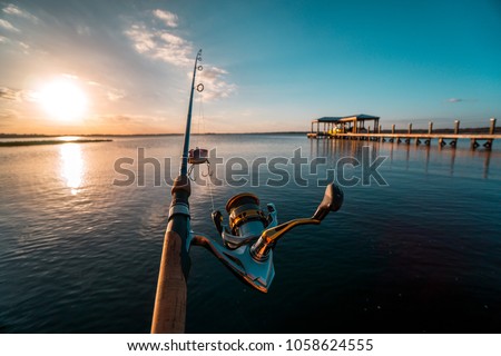 Fishing after a long day at sunset on the beautiful Lake Minnehaha in Clermont, Florida. 