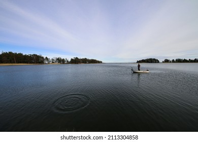 Fishing Alone In A Boat On Lake Vättern In Sweden.