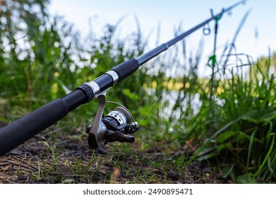 Fishing Blurred Background. Fishing Rod at the Lake. Summer, Spring, Calm, Mental, Silence, Meditation, Chill, Catch. - Powered by Shutterstock