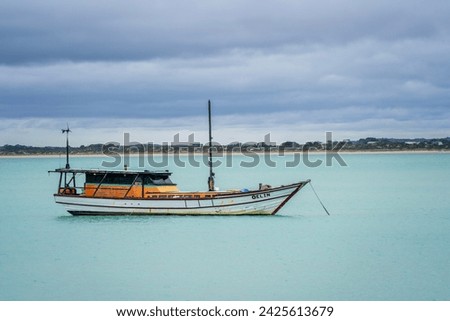 Fishing boat in the calm bay. Robe, South Australia.