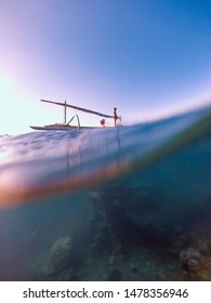 Fishing Boat Crossing The Underwater Ruins Of The Sunken City Of Atlantis. Treasure Of Temple Or Pyramids Building From Ancient Hindu And Roman Civilizations Lost Under The Sea