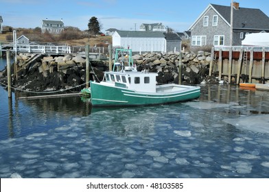 Fishing Boat Docked In An Ice Filled Harbor At Biddeford Pool, Maine