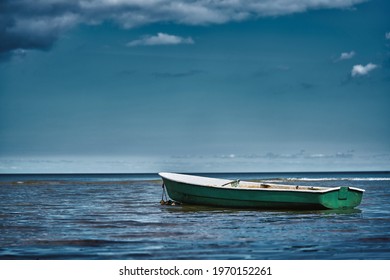Fishing boat floating on the water, blue sea and sky with copy space
