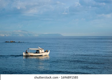 Fishing boat going to sea. Chania, Crete island, Greece