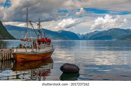 Fishing Boat In The Harbor Of Vik At The Sognefjord In Norway