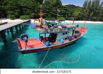 Fishing boat at a jetty in Perhentian Island, Malaysia. Perhentian Island is a popular tourist destination in Malaysia.