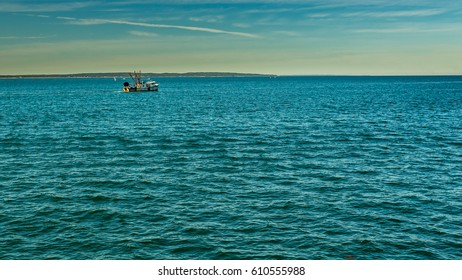 A Fishing Boat Makes It Way Across Vineyard Sound From Falmouth Towards Marthas Vineyard South Of Cape Cod.