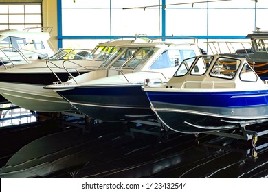 Fishing Boat. Motor Boat For Sale In The Store. Located On A Wheeled Cart