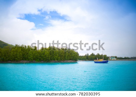 Fishing Boat Off The Coast Of The Tropical Island Landscape Fishing Boat Off The Coast Of The Tropical Island Landscape