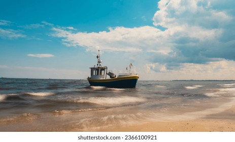 Fishing boat on the beach in Sopot, Poland. Magnificent long exposure calm Baltic Sea. Wallpaper defocused waves. Fishermans sea bay Vacation and holidays. travel attraction - Powered by Shutterstock