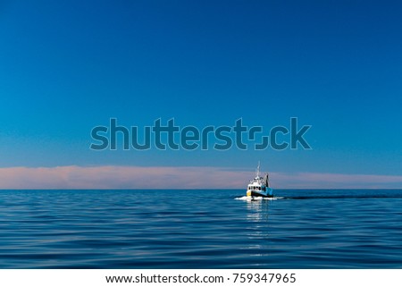 fishing boat on a calm day in the baltic sea