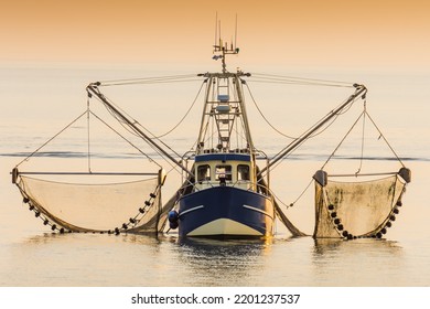 Fishing boat on the North Sea fishes with a trawl net, Schleswig-Holstein, Germany
