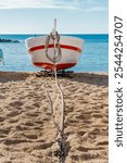 Fishing Boat on Sandy Beach with Sea Background. Calella de Palafrugell, Idyllic Coastal Scene in Catalonia, Spain