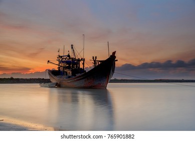 The Fishing Boat On Sunset