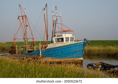 Fishing Boat On A Tidal Creek