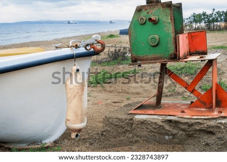 Fishing boat pulled ashore with boat winch mechanism