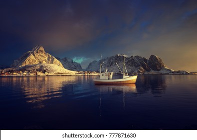 Fishing Boat And Reine Village, Lofoten Islands, Norway