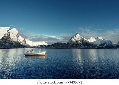 Fishing Boat And Reine Village, Lofoten Islands, Norway