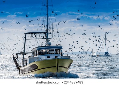 Fishing boat returning from deep sea fishing. - Powered by Shutterstock