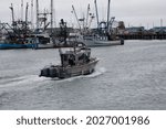 A fishing boat returns to the marina in Westport, WA
