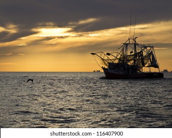 Fishing boat sailing into Gulfport Biloxi Sunset