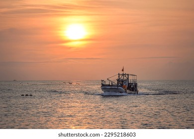 A fishing boat sailing in the sea inthe early morning, Hualian,Taiwan - Powered by Shutterstock