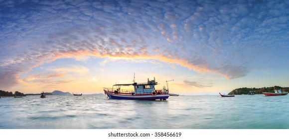 Fishing boat stand at sunrise beach in Phuket, Thailand