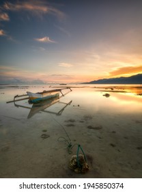 A Fishing Boat Tied Up When The Sun Will Rise