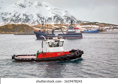 Fishing boat and Tug Boat in Captains Bay in Dutch Harbor AK