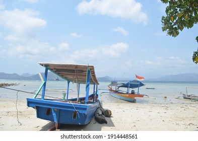 Fishing Boats Being Pulled Over On The Beach